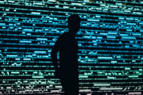 Voyeur, male silhouette over tech background