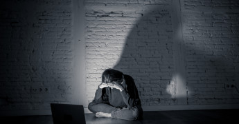 Online harm, sad female, laptop