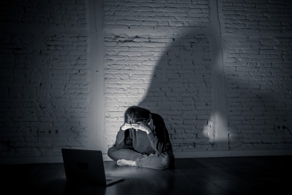 Online harm, sad female, laptop