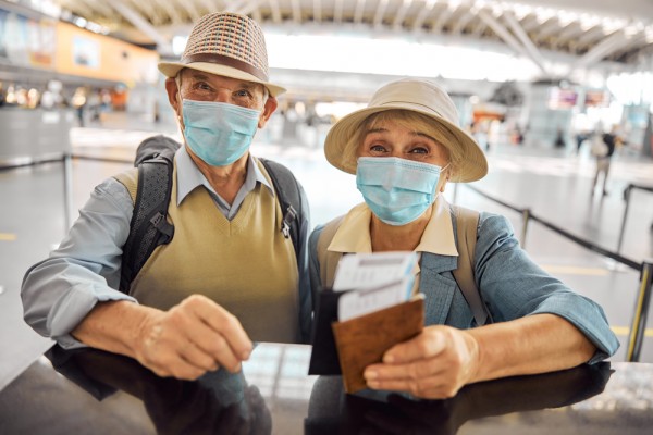 Airport travellers with masks