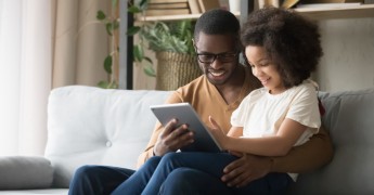 Parent and child with iPad